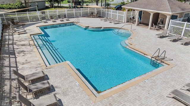 view of swimming pool with a patio area