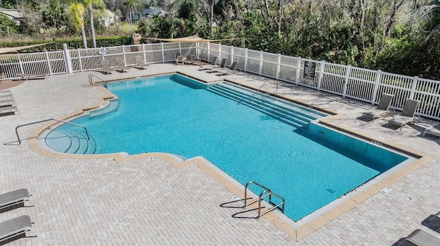 view of swimming pool featuring a patio area