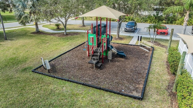 view of jungle gym with a lawn