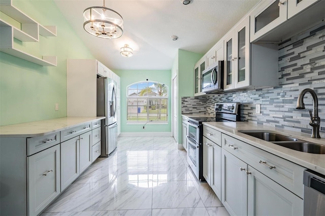 212 Arbor Woods Cir, Oldsmar, FL 34677 - kitchen with open shelves, decorative backsplash, stainless steel appliances, marble finish floor, and a sink