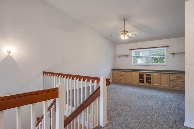 interior space featuring vaulted ceiling and carpet floors