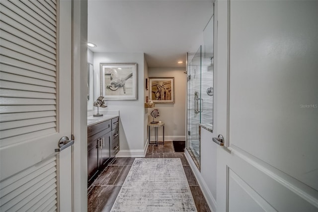 6 Belleview Blvd Unit 203, Belleair, FL 33756 - full bath featuring a shower stall, vanity, baseboards, and recessed lighting