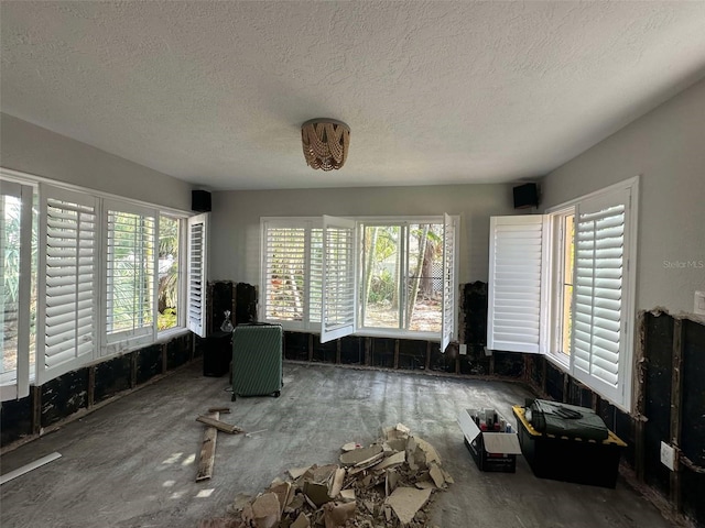 interior space with a textured ceiling