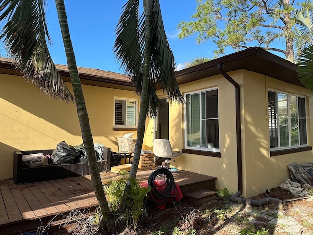 view of home's exterior featuring a wooden deck