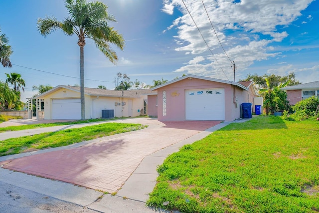 5033 Blue Heron Dr, New Port Richey, FL 34652 - single story home featuring central AC, a garage, and a front lawn