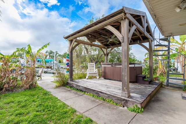 5033 Blue Heron Dr, New Port Richey, FL 34652 - deck with a hot tub and ceiling fan