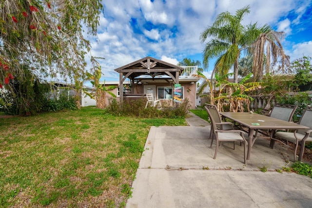 5033 Blue Heron Dr, New Port Richey, FL 34652 - view of front of house with a balcony, a front yard, and a patio area