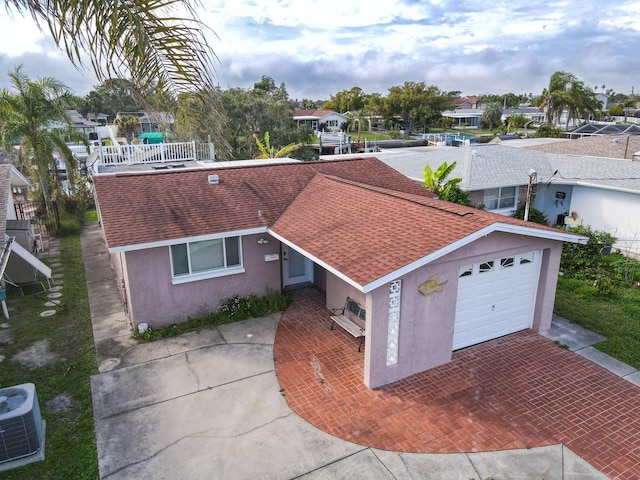 5033 Blue Heron Dr, New Port Richey, FL 34652 - single story home featuring central AC unit and a garage