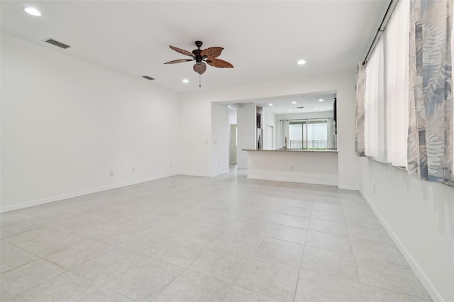 unfurnished living room with baseboards, recessed lighting, visible vents, and a ceiling fan