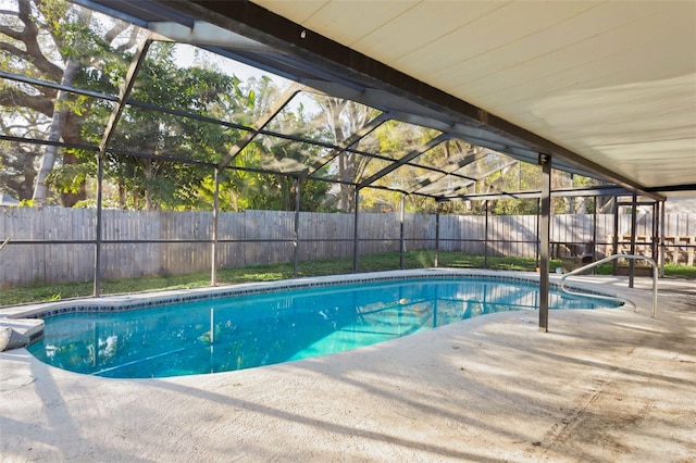 view of pool with a patio and a lanai