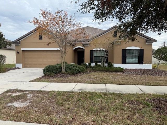 ranch-style home with a garage