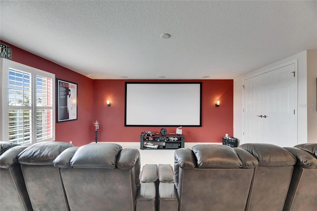 home theater room featuring a textured ceiling