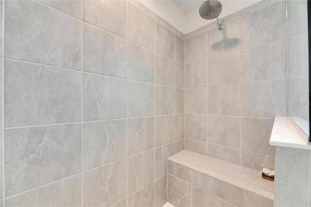 full bathroom with a tile shower