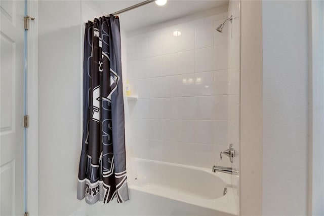 bathroom with shower / tub combo with curtain