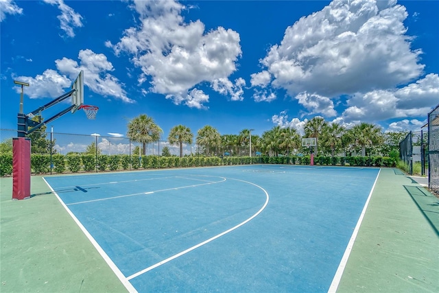 view of basketball court featuring community basketball court and fence