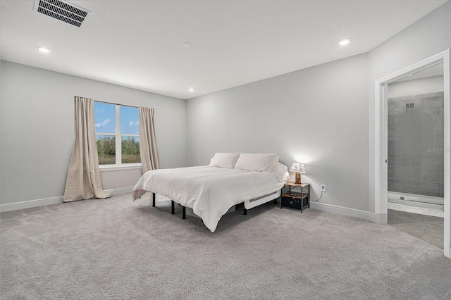 carpeted bedroom with baseboards, visible vents, ensuite bathroom, and recessed lighting