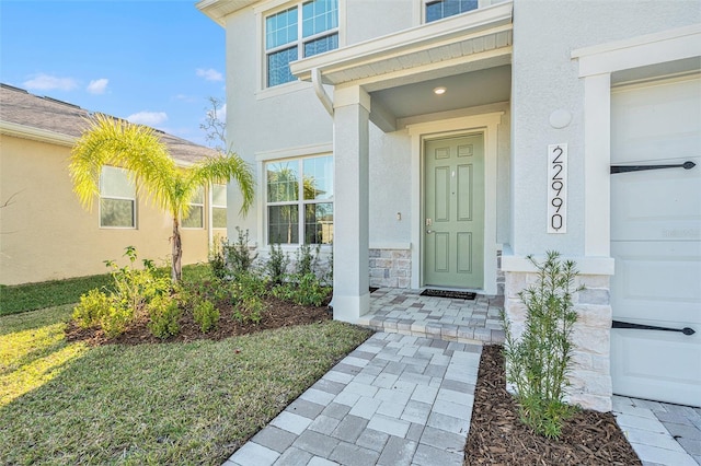 22990 Scaglione Dr, Lutz, FL 33549 - view of exterior entry with stucco siding and stone siding