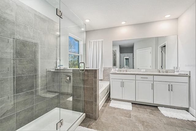 22990 Scaglione Dr, Lutz, FL 33549 - full bathroom with double vanity, a stall shower, and a garden tub
