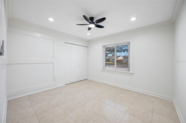 unfurnished bedroom with crown molding, ceiling fan, and a closet