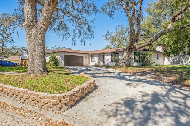 single story home featuring a garage