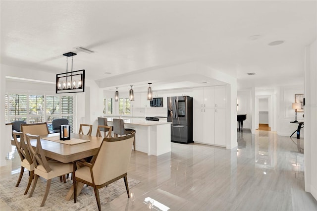 dining space featuring an inviting chandelier