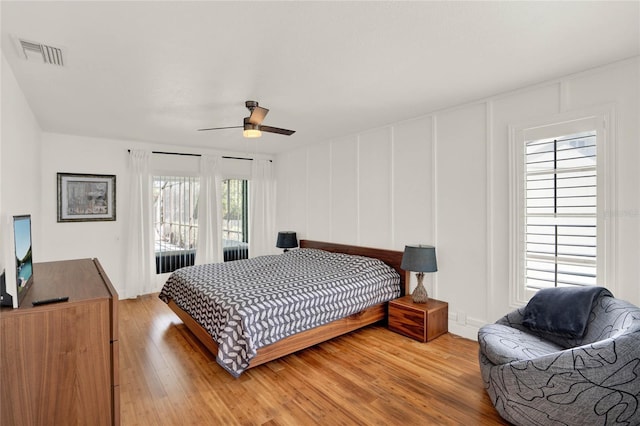 bedroom featuring ceiling fan and hardwood / wood-style floors