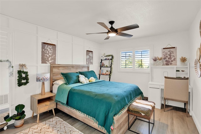 bedroom featuring hardwood / wood-style floors and ceiling fan