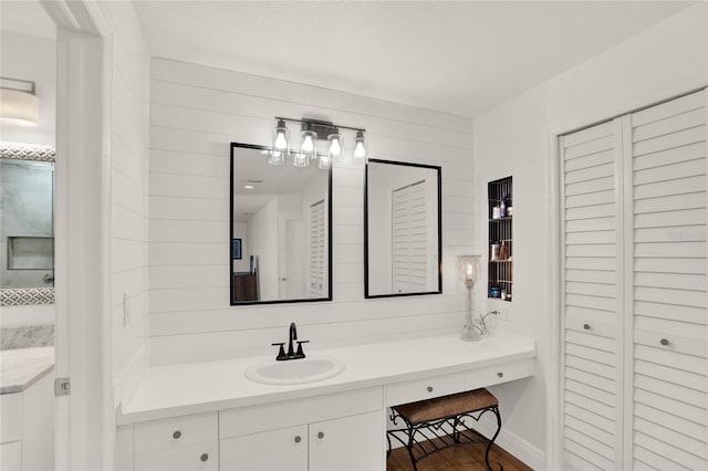 bathroom featuring hardwood / wood-style flooring and vanity