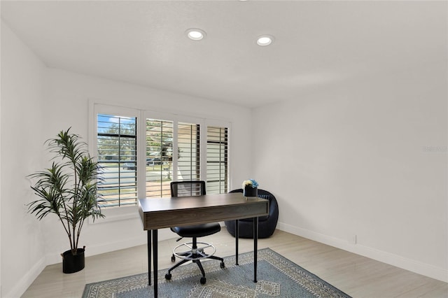 home office featuring light hardwood / wood-style floors