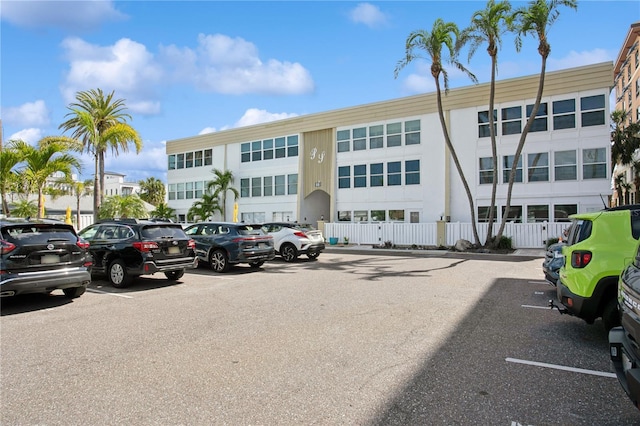 view of building exterior featuring uncovered parking