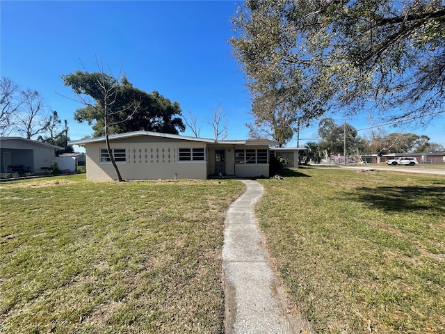 ranch-style house with a front yard