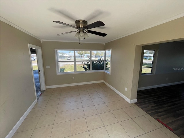 empty room featuring crown molding and ceiling fan