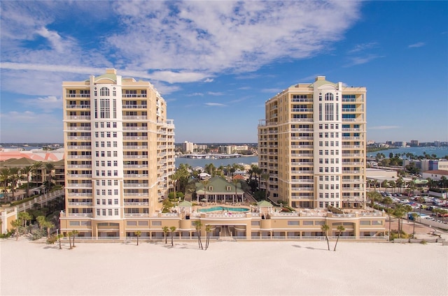 view of property with a view of city and a water view