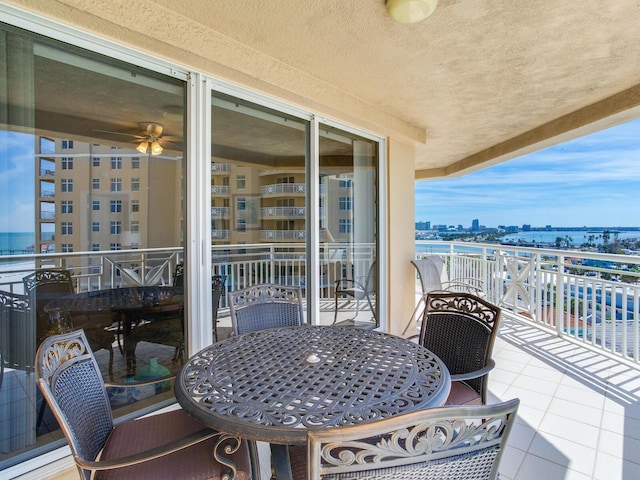 balcony with a water view and a city view