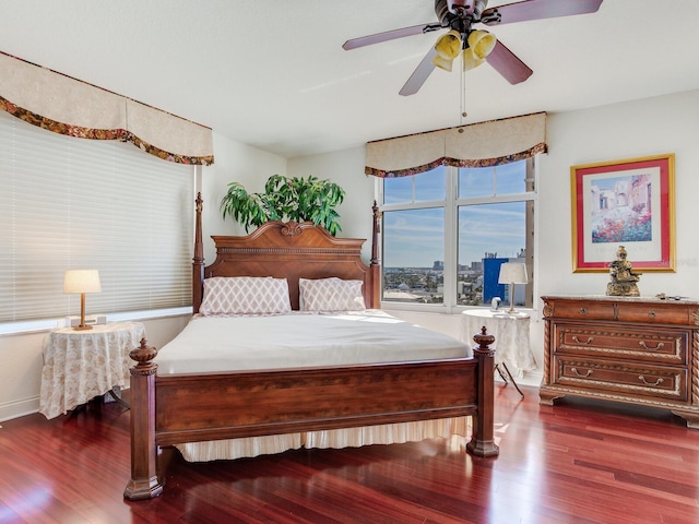 bedroom featuring dark wood finished floors and ceiling fan