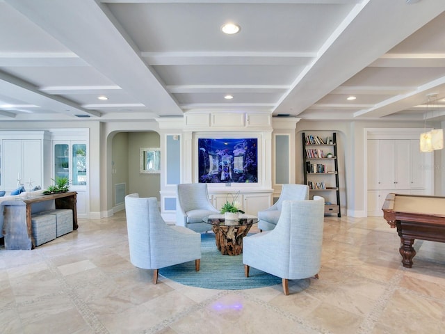 living area with arched walkways, beam ceiling, baseboards, and recessed lighting