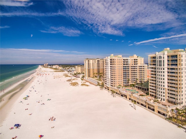 bird's eye view with a water view, a view of city, and a view of the beach