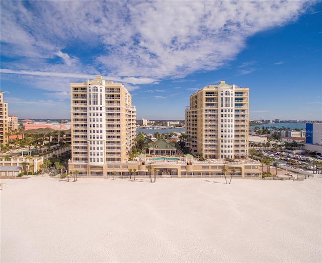 view of property with a city view and a water view