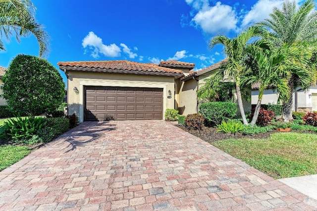 mediterranean / spanish-style house featuring a garage