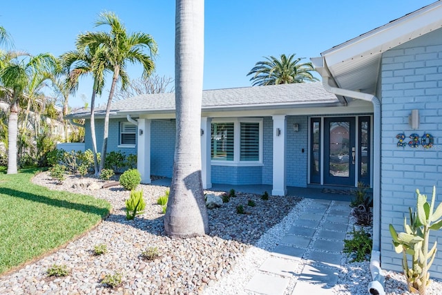 property entrance with a yard