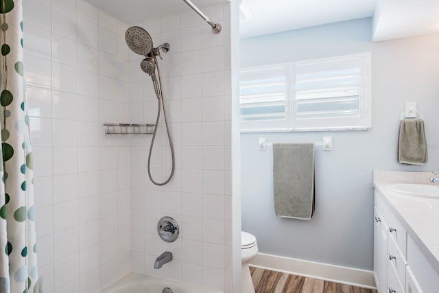 full bathroom with wood-type flooring, shower / bath combo, vanity, and toilet