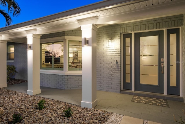 property entrance with covered porch