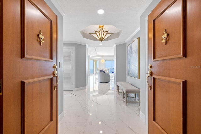 foyer with recessed lighting, marble finish floor, crown molding, and baseboards