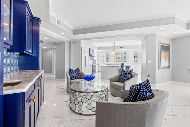 living room featuring baseboards, visible vents, a raised ceiling, marble finish floor, and a textured ceiling