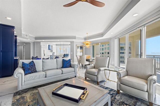 living room with marble finish floor, a raised ceiling, visible vents, ceiling fan, and a textured ceiling