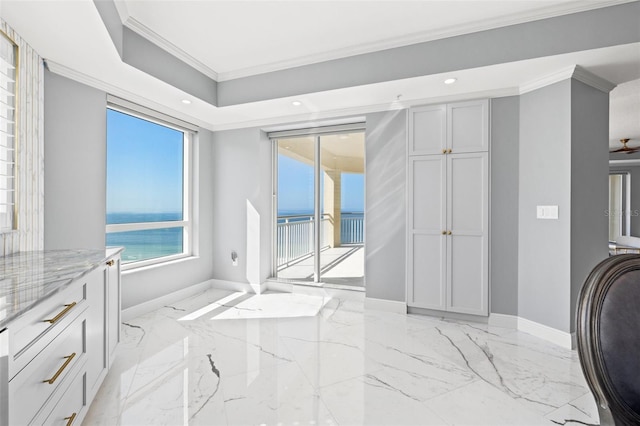 interior space featuring marble finish floor, baseboards, crown molding, and recessed lighting