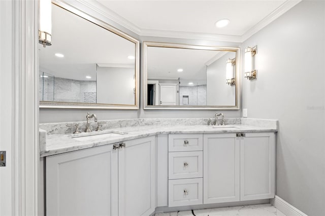 bathroom with ornamental molding, marble finish floor, a sink, and double vanity