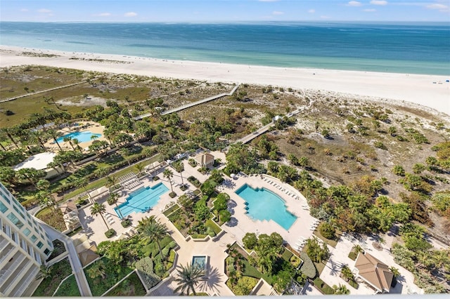 aerial view featuring a water view and a beach view