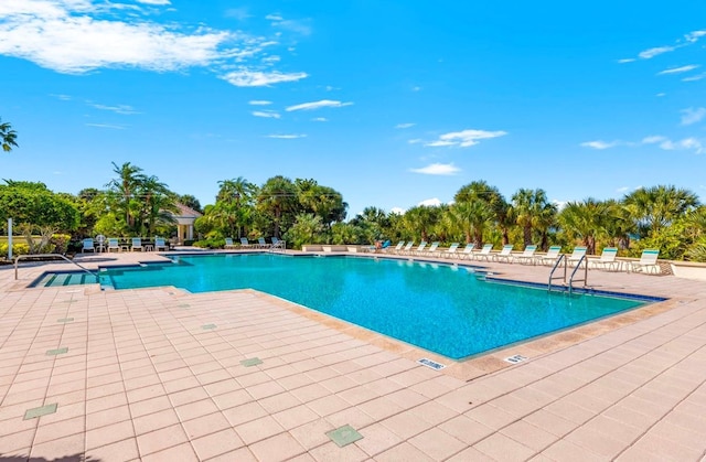 community pool featuring a patio area