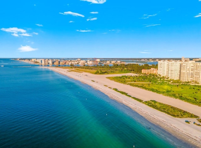 birds eye view of property with a water view, a view of city, and a view of the beach